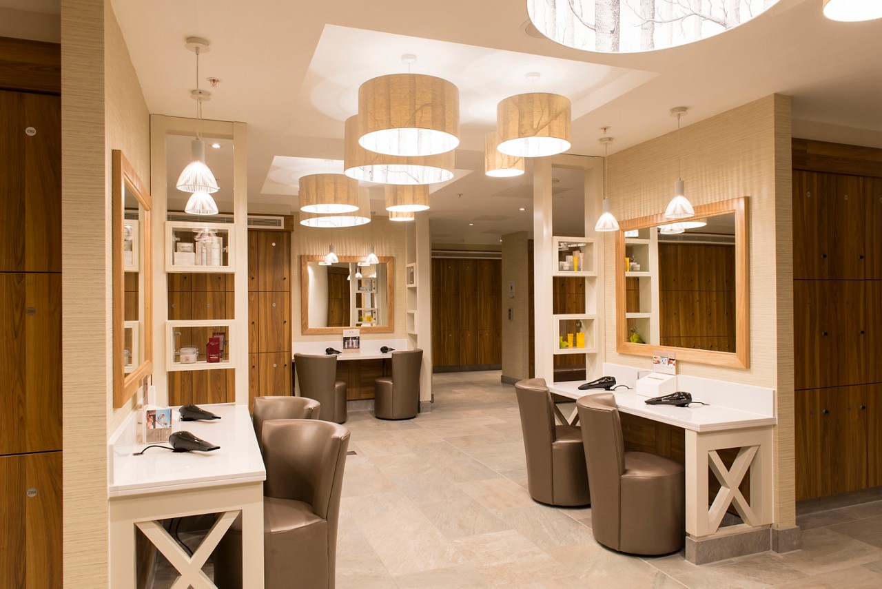 Changing area with large mirrors, hair drying stations and lockers.